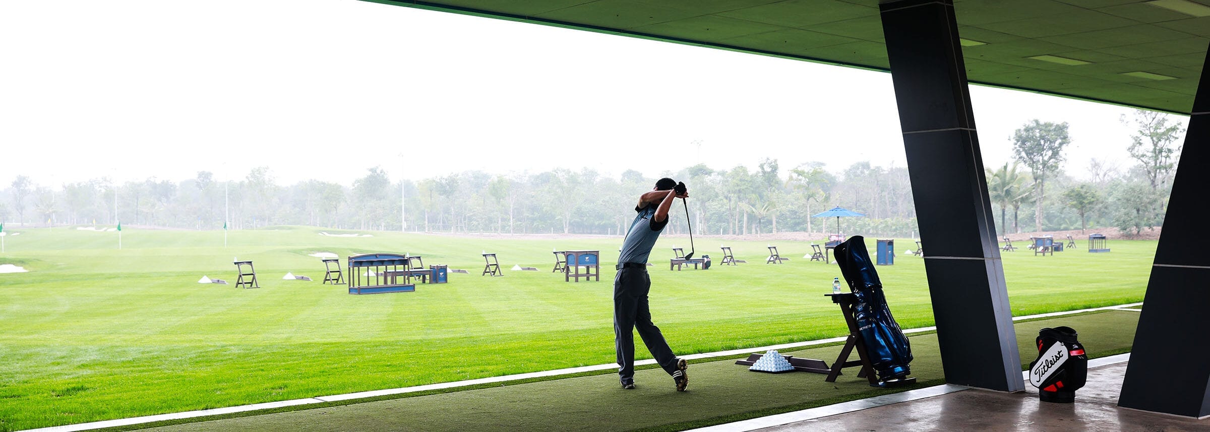 man taking a swing at a golf course