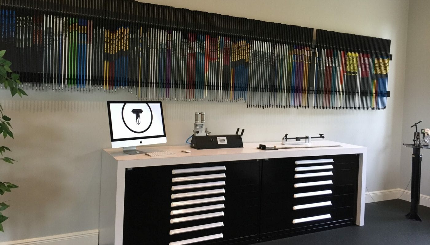 a golf shop with a wall full of golf clubs
