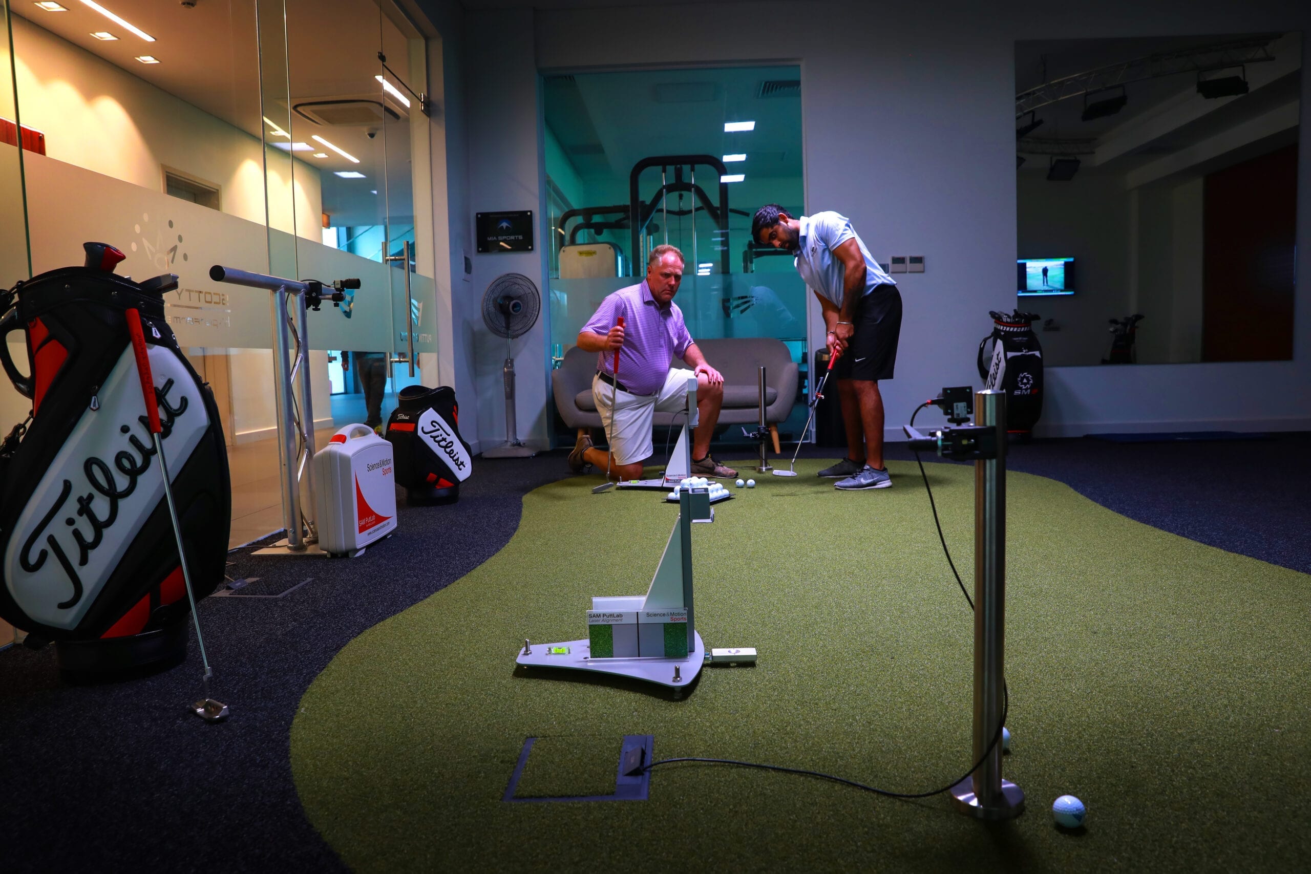 instructor directing a golf student