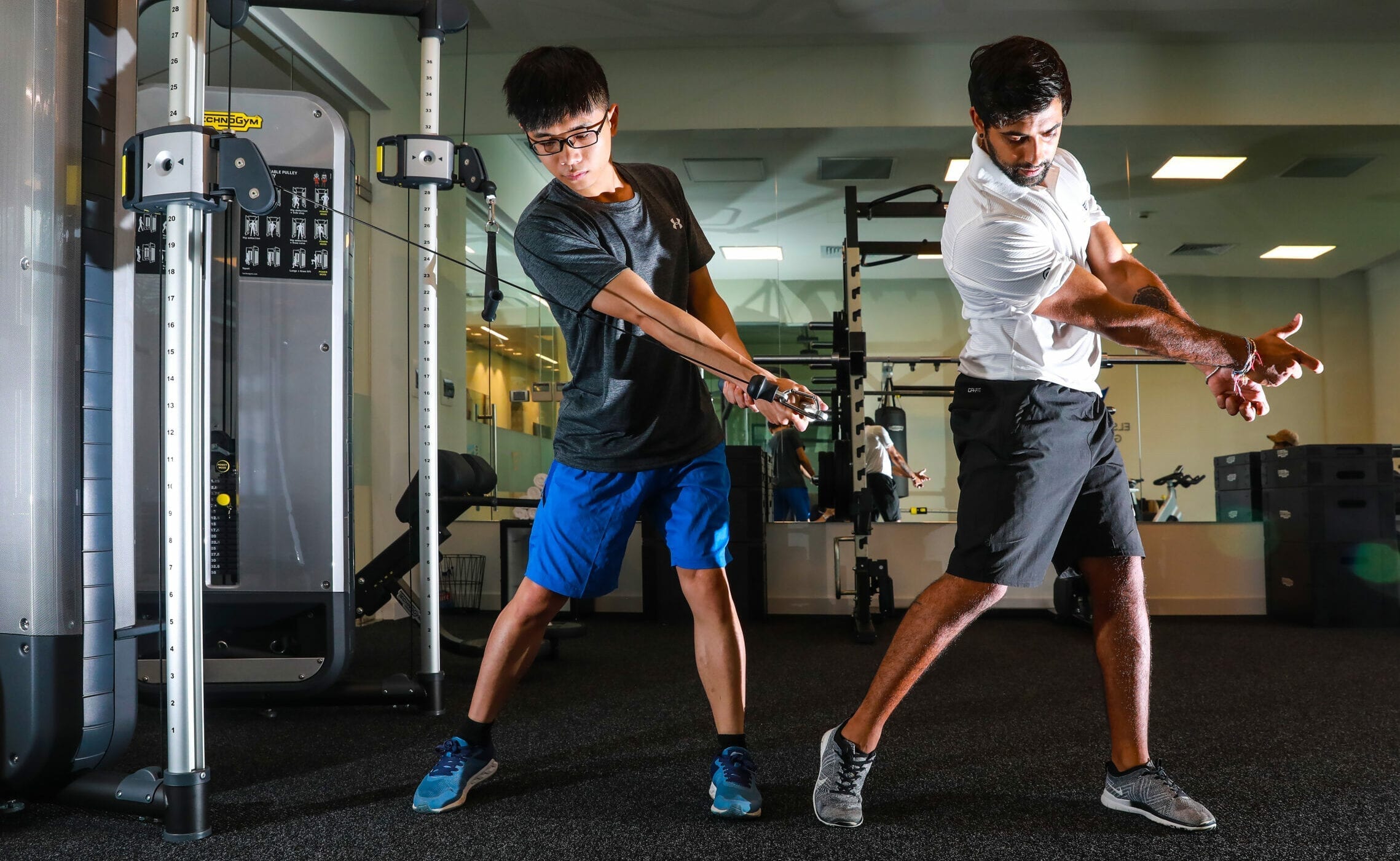 instructor and student in the gym