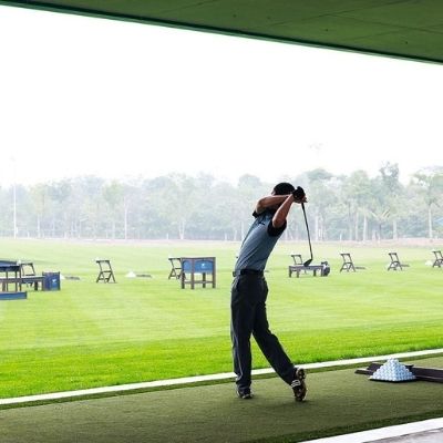 man taking a swing with a golf club